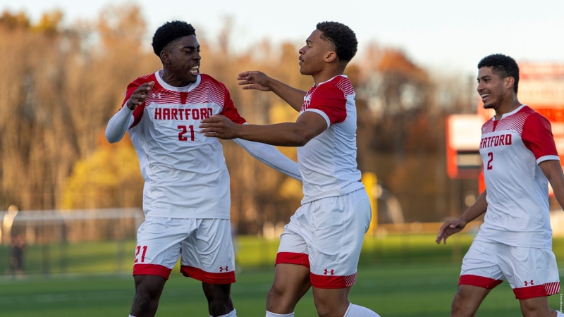 three players celebrate